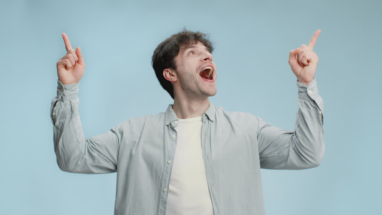 Excited Man Pointing Upwards