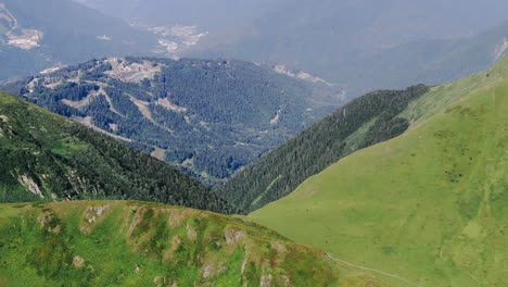 view from the high track in caucasus mountains glaciers, green grass, wild lakes