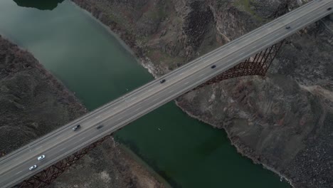 perrine bridge traffic over snake river, twin falls idaho usa, cinematic aerial view