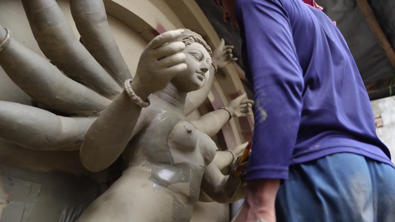 In Kumortuli, idol artists are making idols of Durga, the revered deity of Hinduism. The work of making these idols starts from June and these potters make many idols till November.