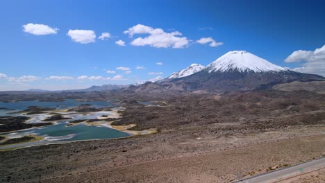 aerial view of parinacota volcano, lauca national park in chile - dolly, drone shot