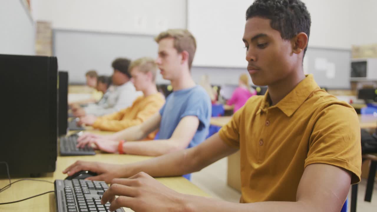 Students working on computers in high school class