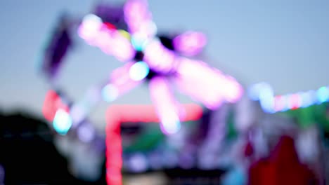 blurred lights of a spinning amusement park ride