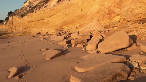 Walk-along-the-rugged-stone-and-rocky-formations-arranged-against-the-canvas-of-a-serene-blue-sky