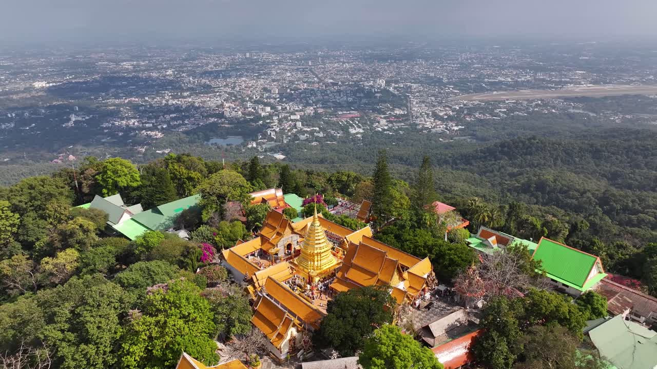 Aerial view of Buddhist Temple on hill with golden pagoda, Chiang Mai, Thailand. Tourist attraction