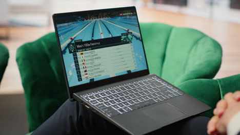 vertical video bucharest, romania - july 30th 2024 - director watches olympics swimming trial