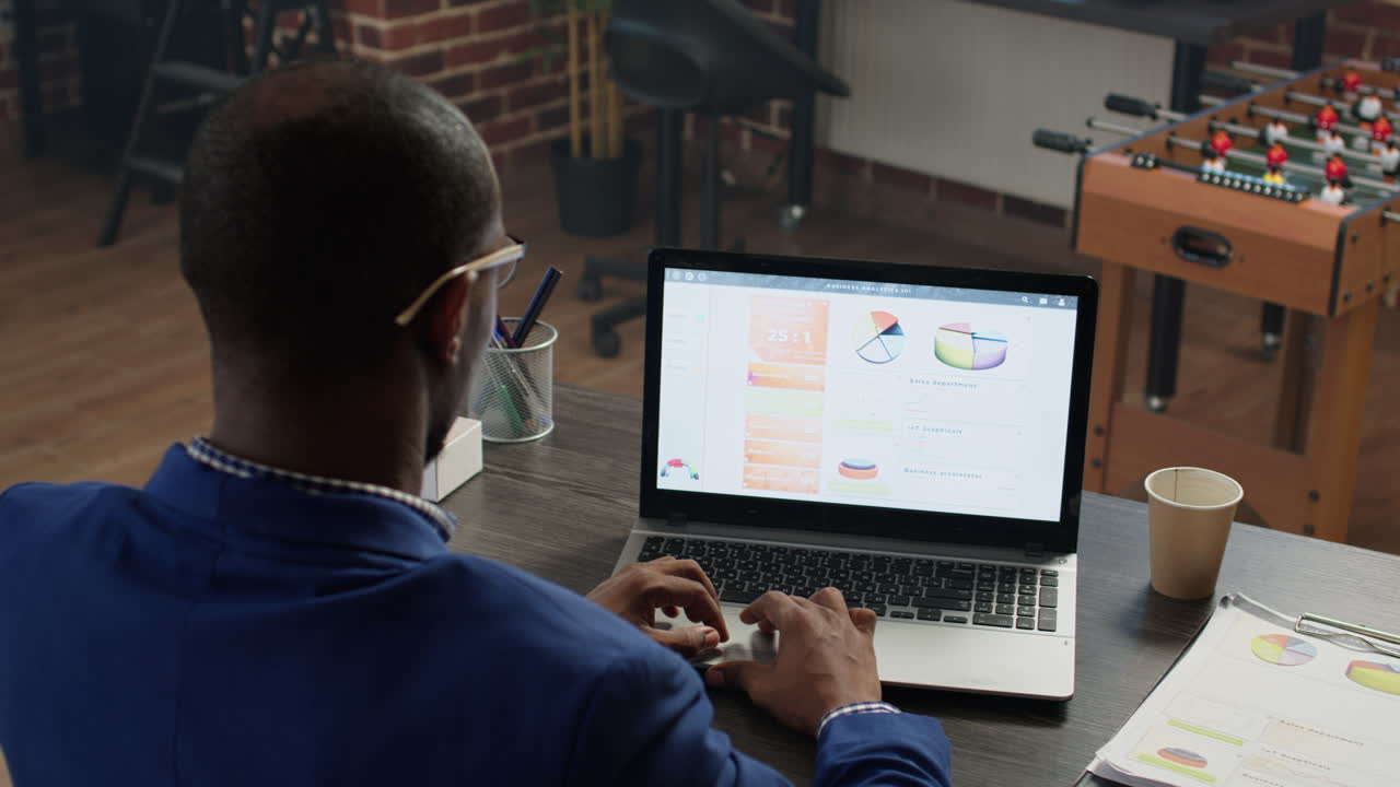 Office employee working with data statistics at desk