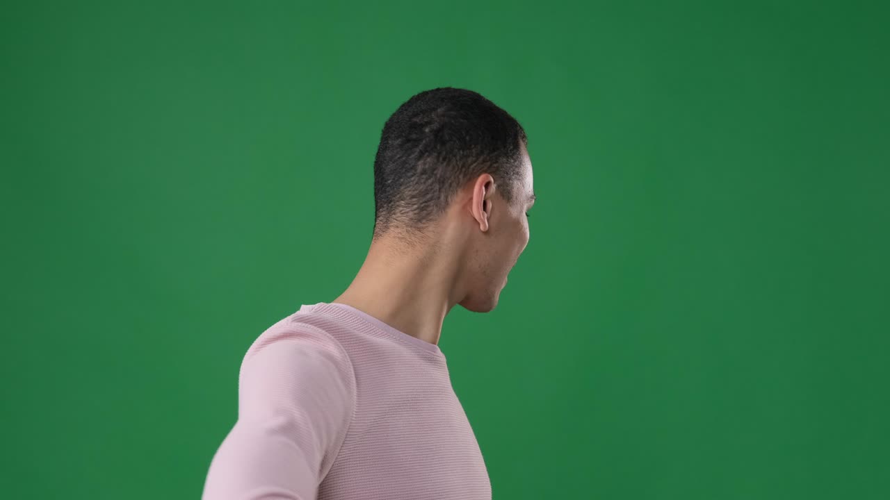 Man inviting to come over green background