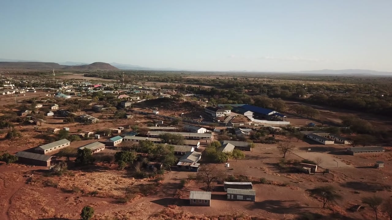 Aerial view of Kakuma in Turkana County, Kenya, showing the dry landscape, scattered buildings, and settlement layout.