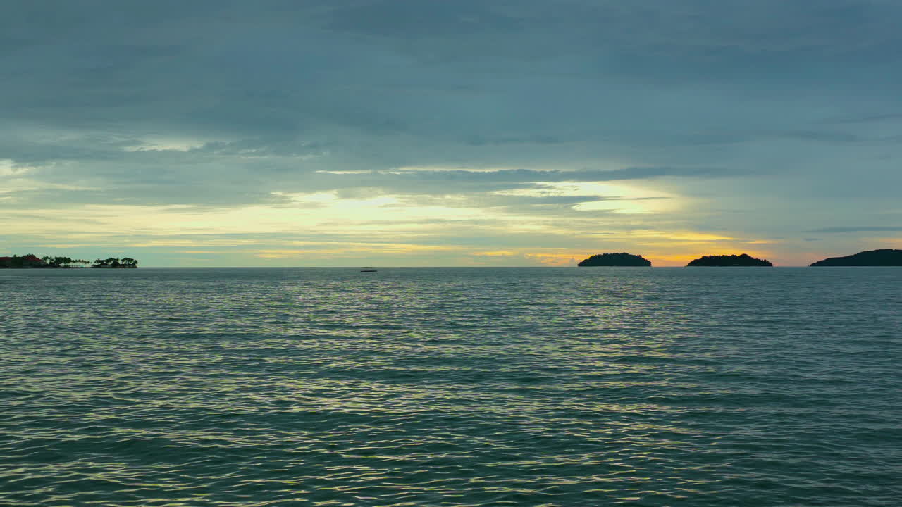 Scenic Sunset Over Tropical Beach At Kota Kinabalu On The Island of Borneo In Sabah, Malaysia. Aerial Wide Shot