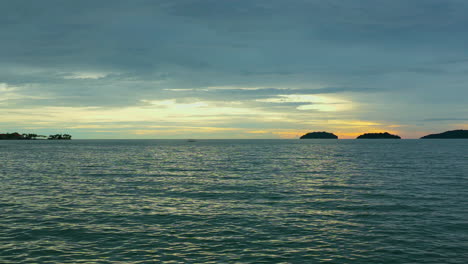 Scenic Sunset Over Tropical Beach At Kota Kinabalu On The Island of Borneo In Sabah, Malaysia. Aerial Wide Shot