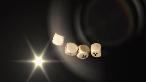 rotating dice spelling baby with glowing star animation on dark background