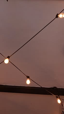 String lights illuminate a hotel ceiling