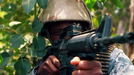 military man praticing to shoot with a gun in the boot camp