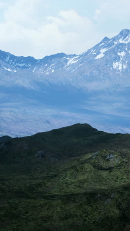 stunning view of a mountain range with snow covered peaks