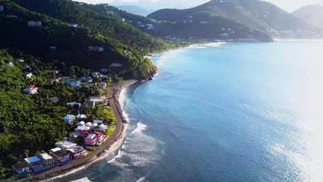 aerial british virgin island tortola beach fly by of local homes on the water angle 1