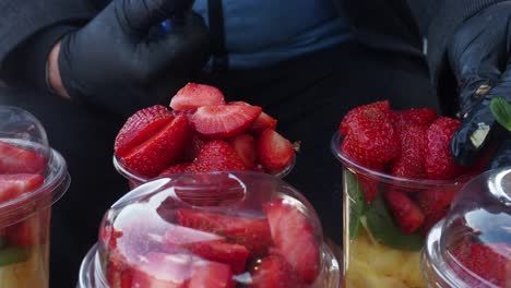 vendor selling fresh fruit cups