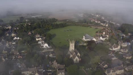 drone shot pulling away from islip church in mist 02