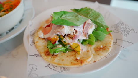 Taco-on-plate-indoors-in-restaurant