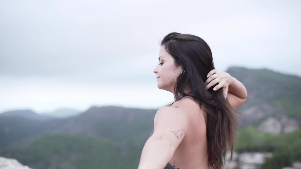Woman in Yoga Pose with Mountain View