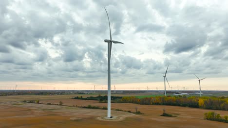 cloudy day in late autumn near giant wind turbines