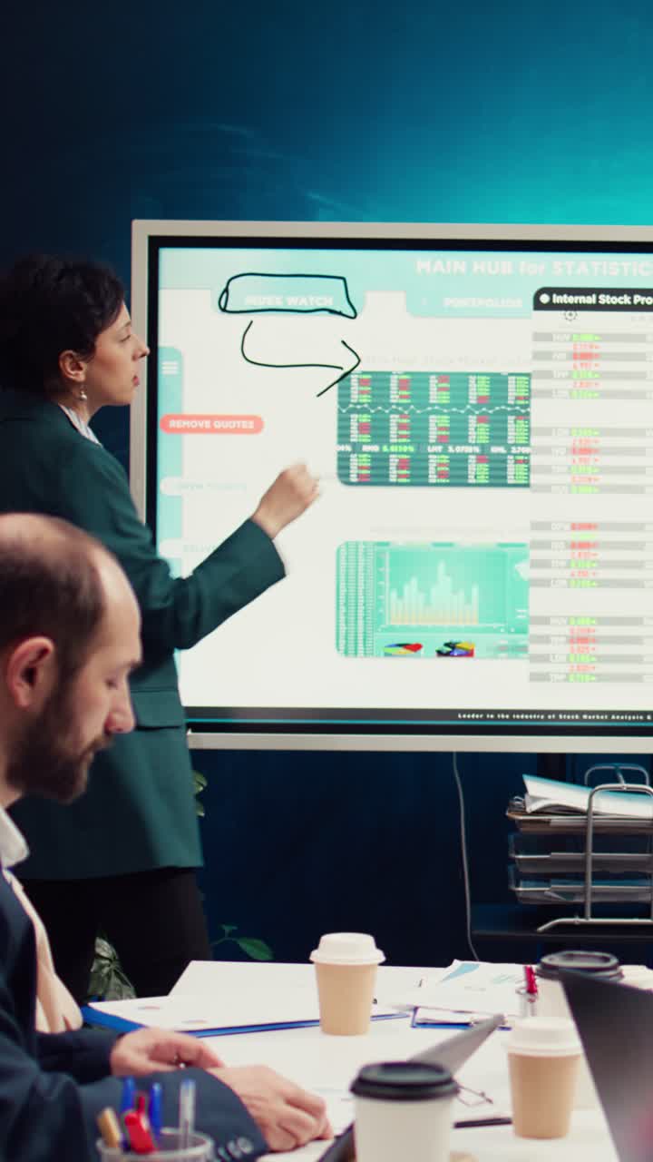 Woman Presenting Financial Data and Charts in a Business Meeting