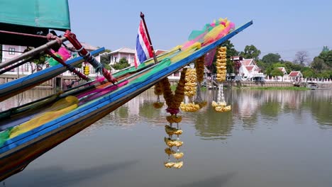 colorful boat with flower garlands on river