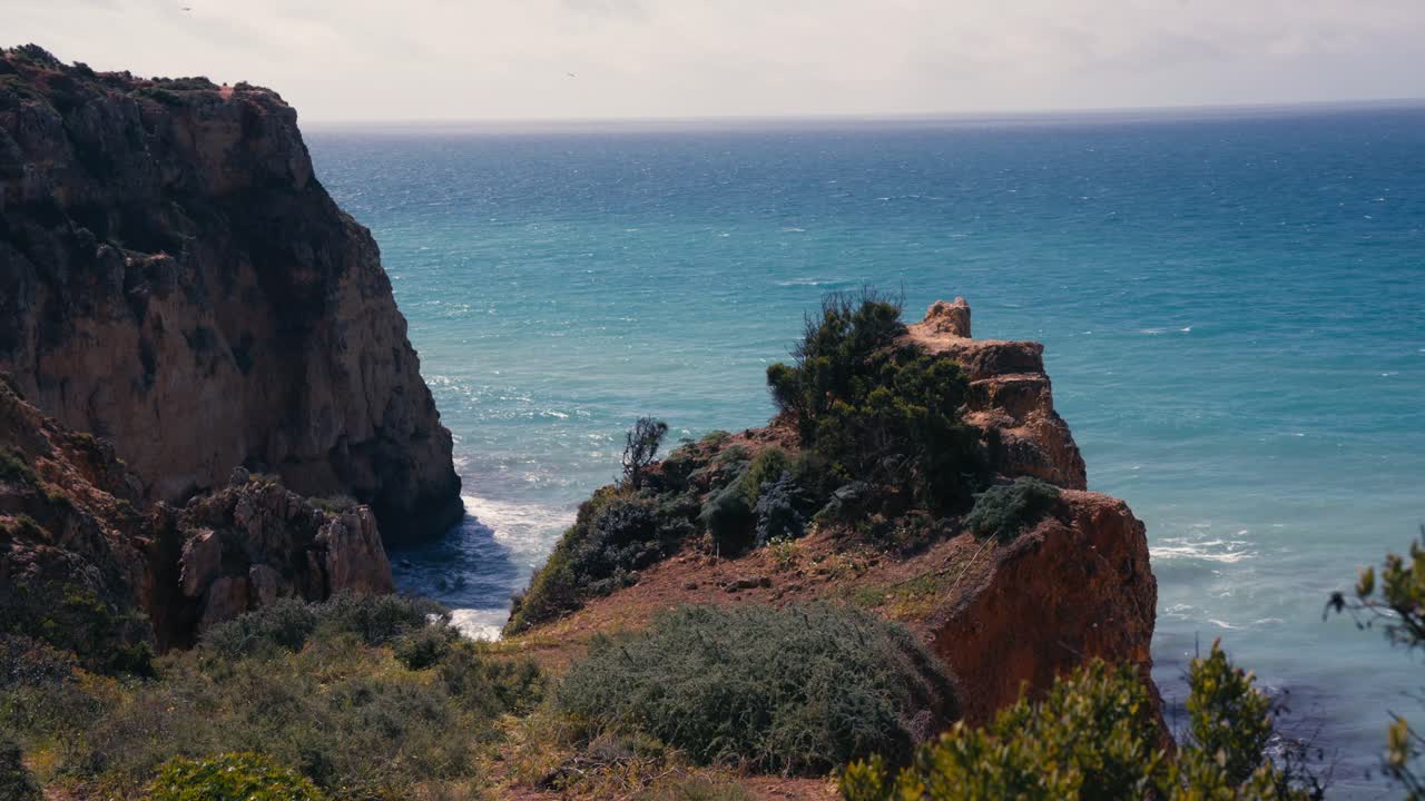 Serene Coastline With Rugged Cliffs At Ponta da Piedade On The Algarve Region Near Lagos, Portugal. Static Shot