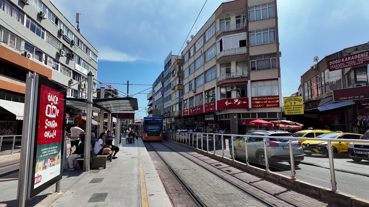 A vibrant view of Antalya’s city center featuring the modern tramway, a blend of urban life and scenic surroundings.