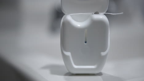 Close-Up-of-Dental-Floss-on-a-Sink