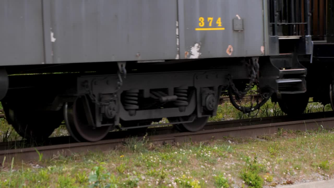 White Pass and Yukon Route train leaving Skagway, Alaska.Detail of the train wheels and train tracks.