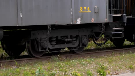 white pass and yukon route train leaving skagway, alaska.detail of the train wheels and train tracks.