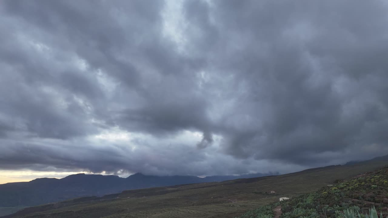 Dramatic clouds moving over volcanic landscape in Gran canaria, canary islands. Timelapse footage