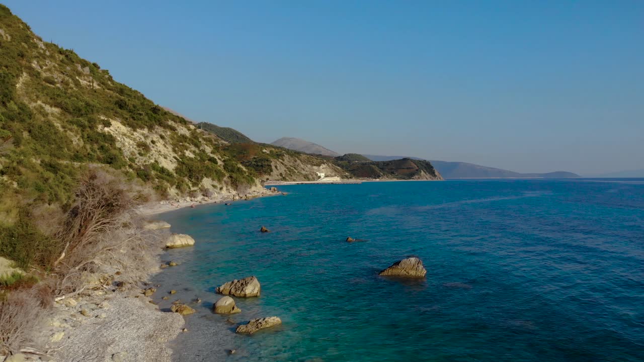 Fabulous seascape with colorful rocky coastline washed by calm blue azure sea water in Albania