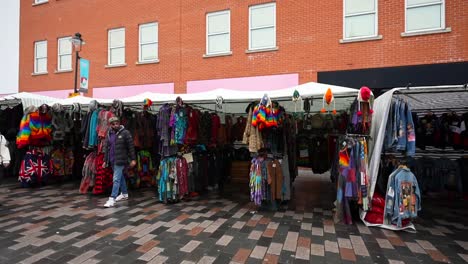 colorful street market with clothing and accessories