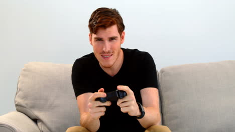 man playing joystick game on sofa 4k