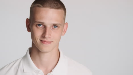 teenager turning his head to the front and smiling