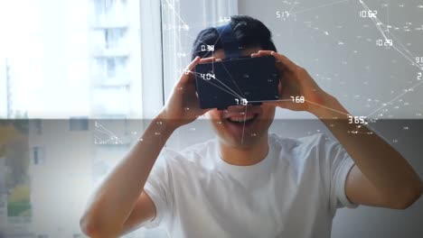 Animation-of-globe-with-network-of-connections-over-man-using-vr-headset