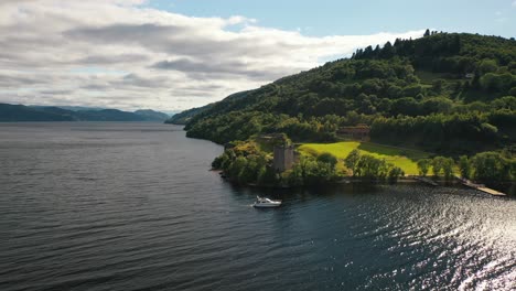 Loch-Ness-And-Urquhart-Castle,-Scottish-Highlands,-Aerial-Drone-Footage