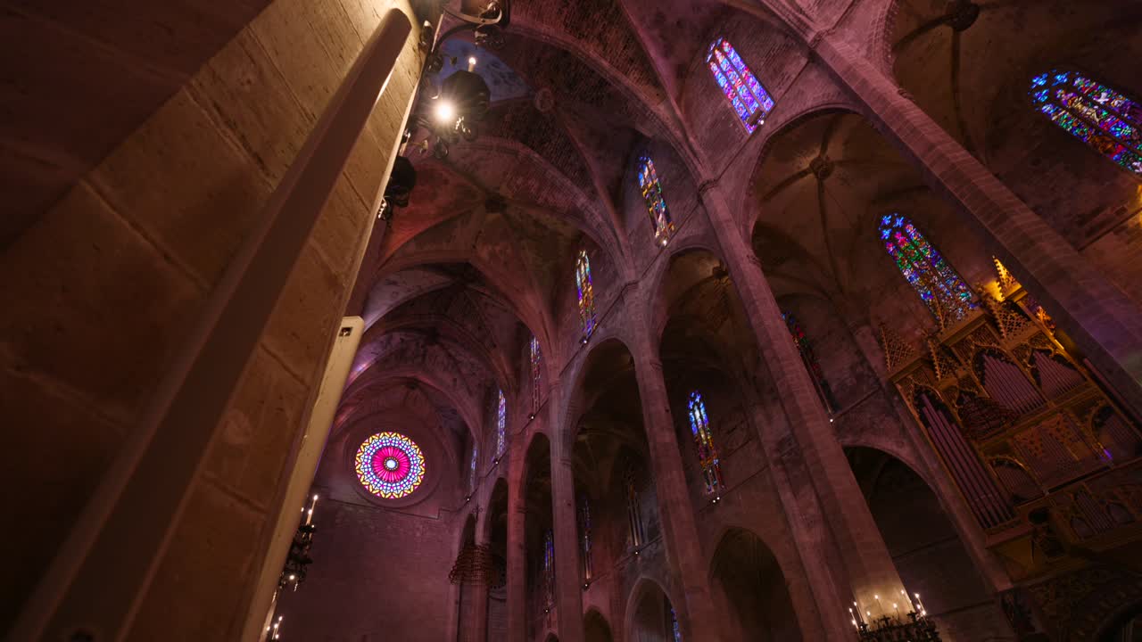Grand Interior of a Historic Gothic Cathedral with Stained Glass Windows