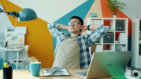 relaxed man at a modern office desk