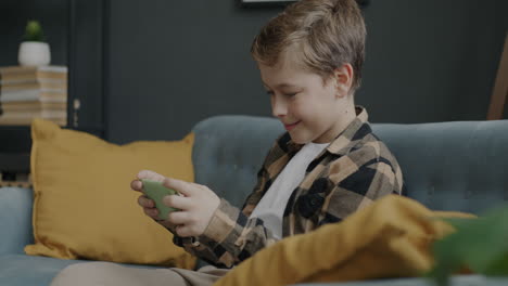 boy playing games on smartphone