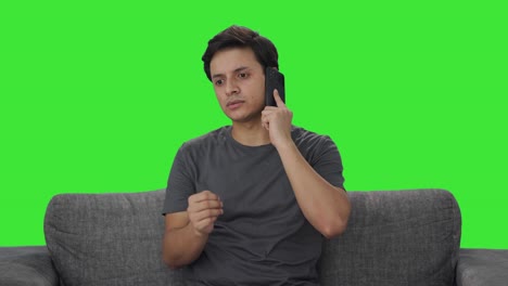 Indian-man-talking-on-phone-Green-screen