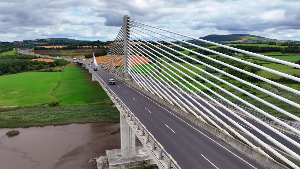 Ireland Epic locations side view of traffic crossing the Fitzgerald Kennedy suspension bridge over the Barrow river