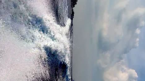 extreme low angle pov of speedboat water trail, sea level view