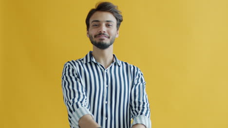happy man posing in a striped shirt
