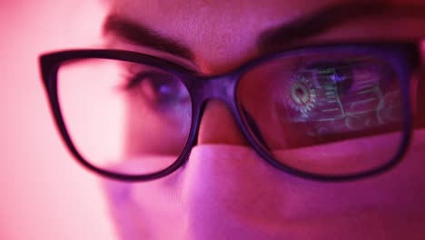 scientist woman studying data of coronavirus outbreak virus model displayed on laptop screen reflected on glasses