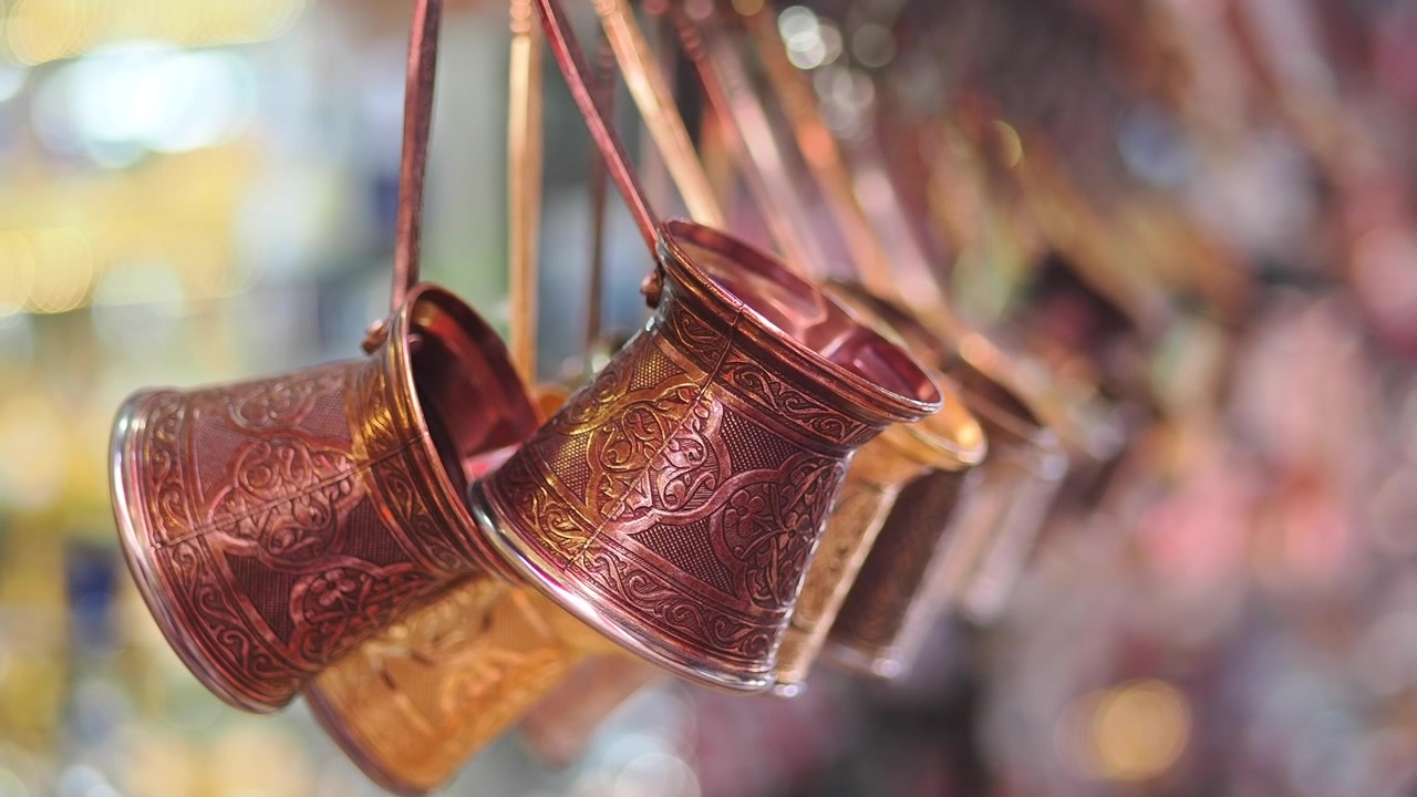 Traditional Copper Turkish Coffee Pots Hanging in a Market