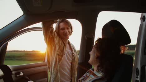 couple enjoying a sunset road trip