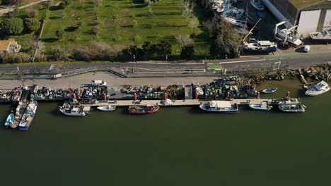 Docked-fishing-small-boats-in-Grau-d'Agde-harbor-aerial-drone-view